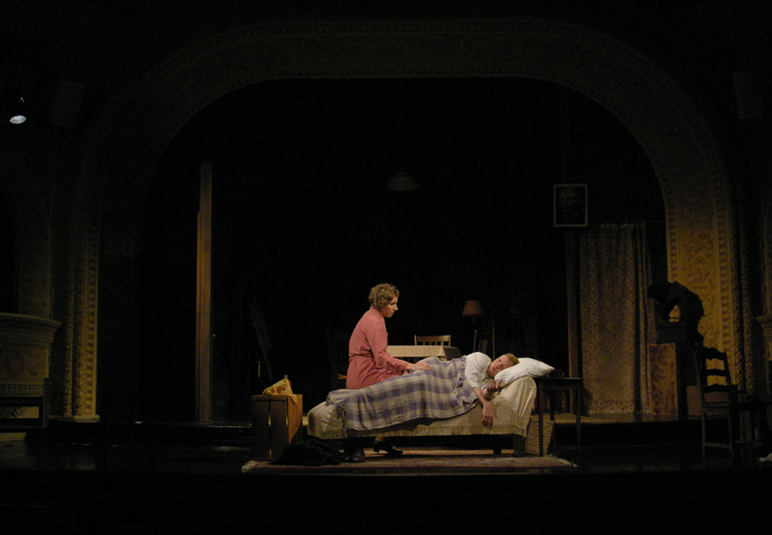Laura tucks Tom into bed--Theater at Monmouth's GLASS MENAGERIE