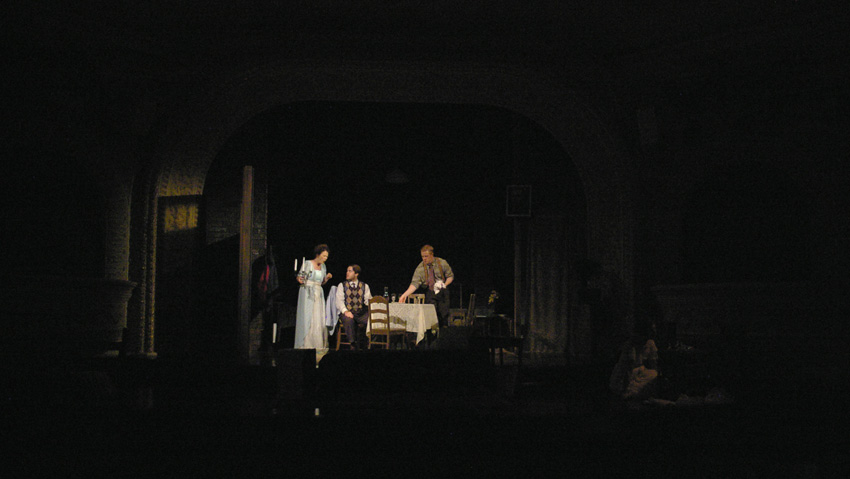 Amanda suggests that Jim keep Laura company in the front room--Theater at Monmouth's GLASS MENAGERIE