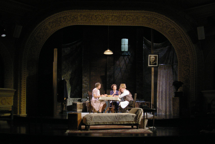 Amanda 'instructs' her grown son in how to eat dinner--Theater at Monmouth's GLASS MENAGERIE
